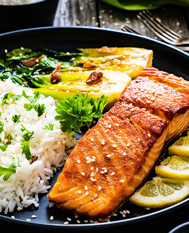 Sweet and Savory Salmon Plated with Rice and Veggies