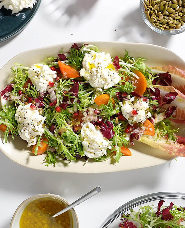 Winter Greens Salad with Persimmon, Burrata, and Honey Shallot Dressing