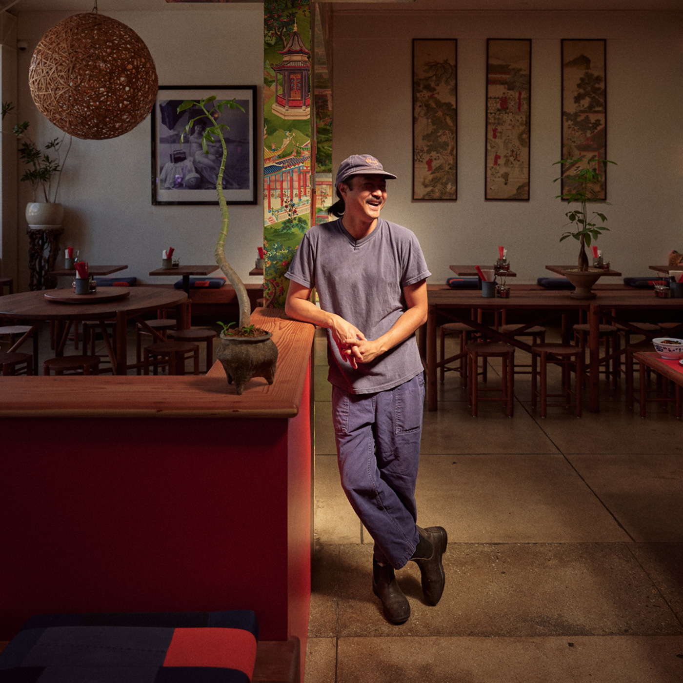 founder of Woon leaning on bar