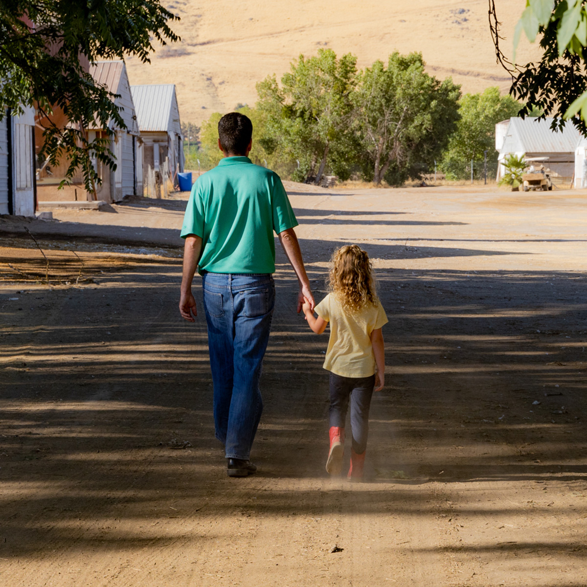 David Pitman walking with little girl