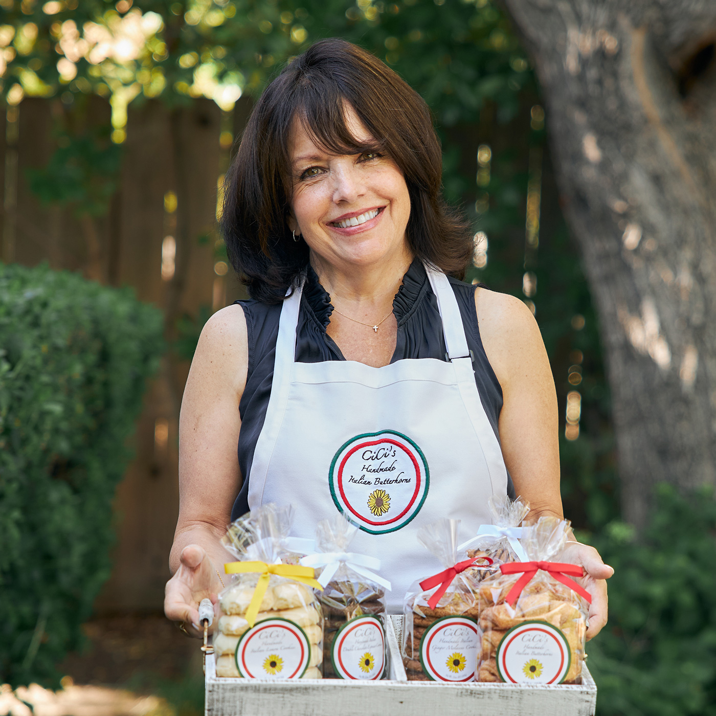 Founder Christine Falatico holding cookies