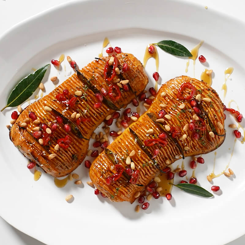 Holiday Hassselback Butternut Squash with Pomegranate and Pine Nuts