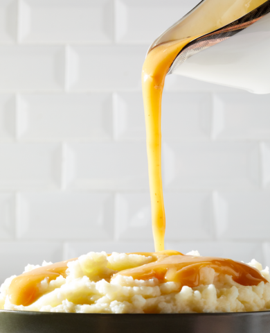 gravy pouring on mashed potatoes