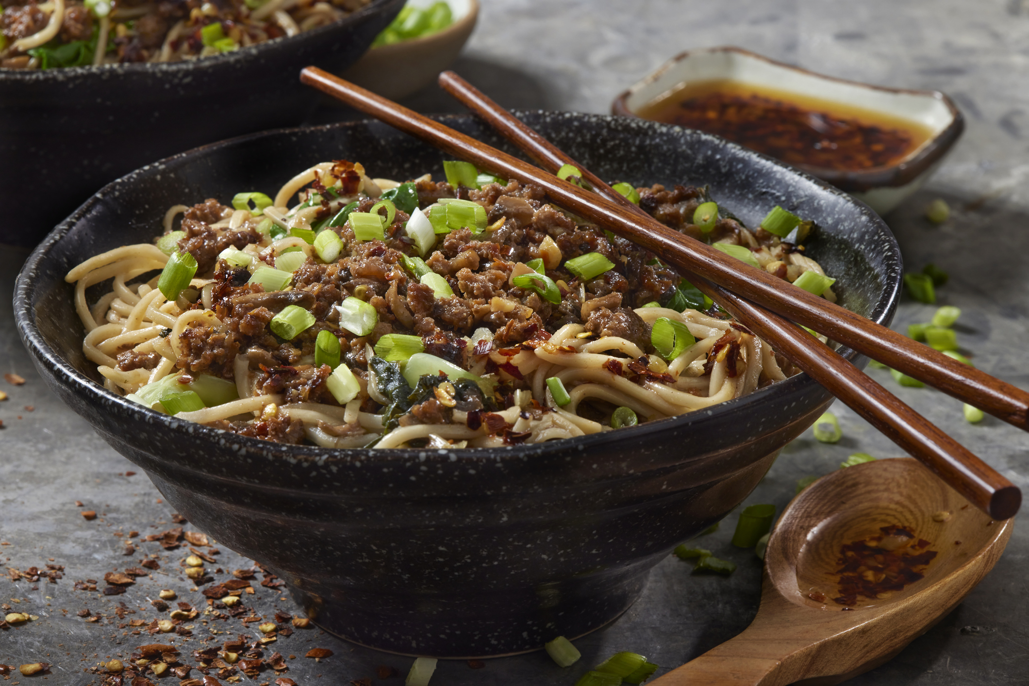 Bowl of noodles with pork and green onion 