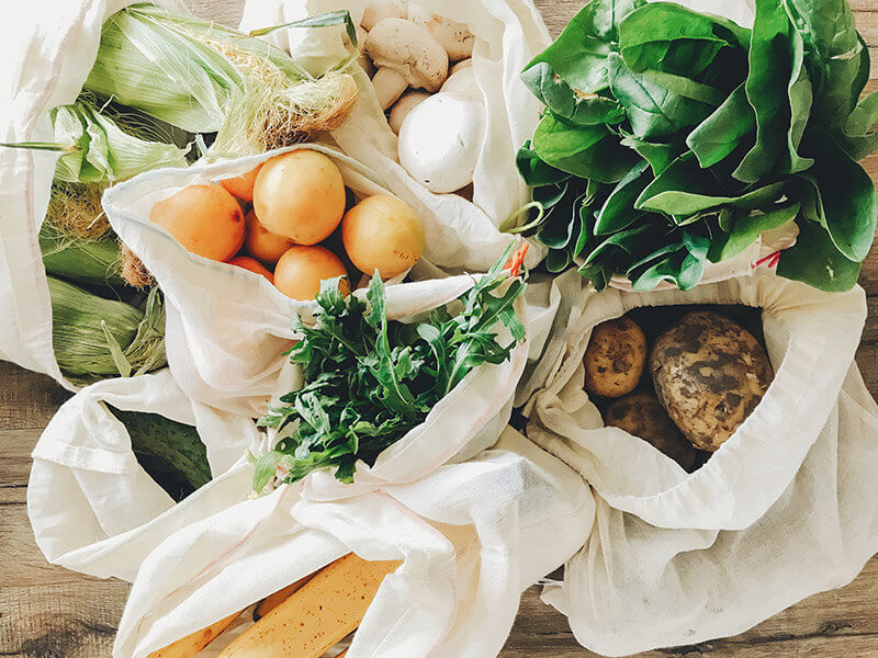 Assorted produce in canvas bags