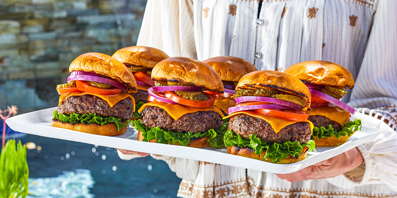 Burgers being served on a plate