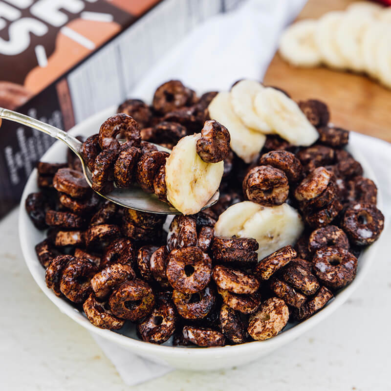 Bowl of chocolate cereal with bananas