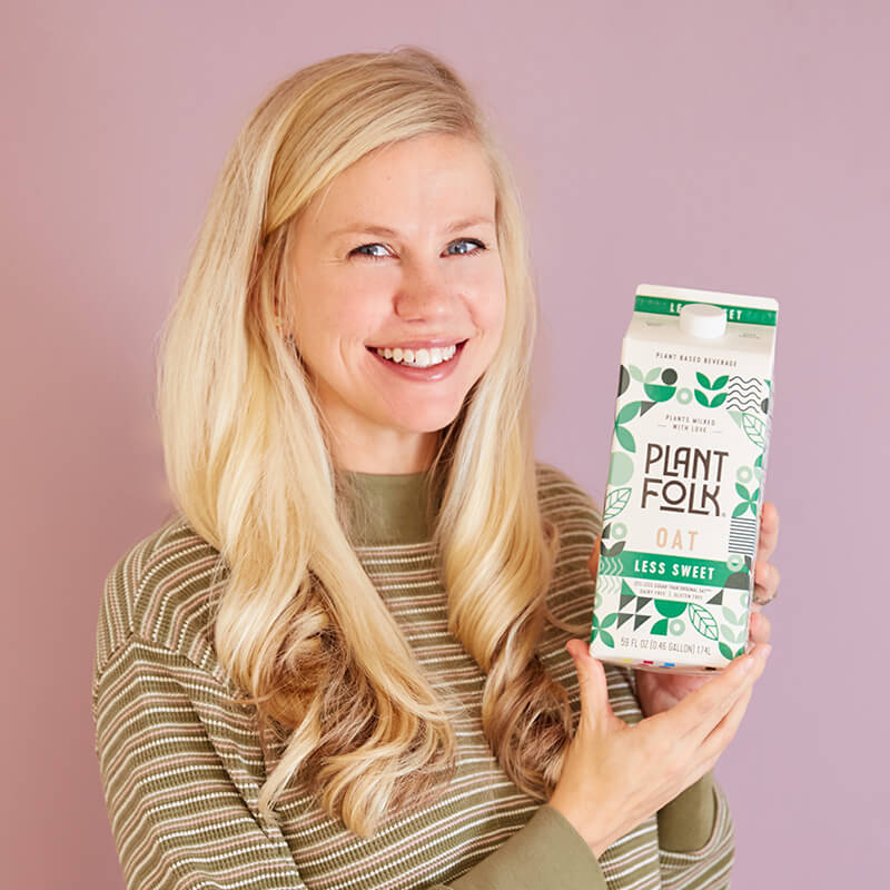 Founder Emily Johnson holding oat milk