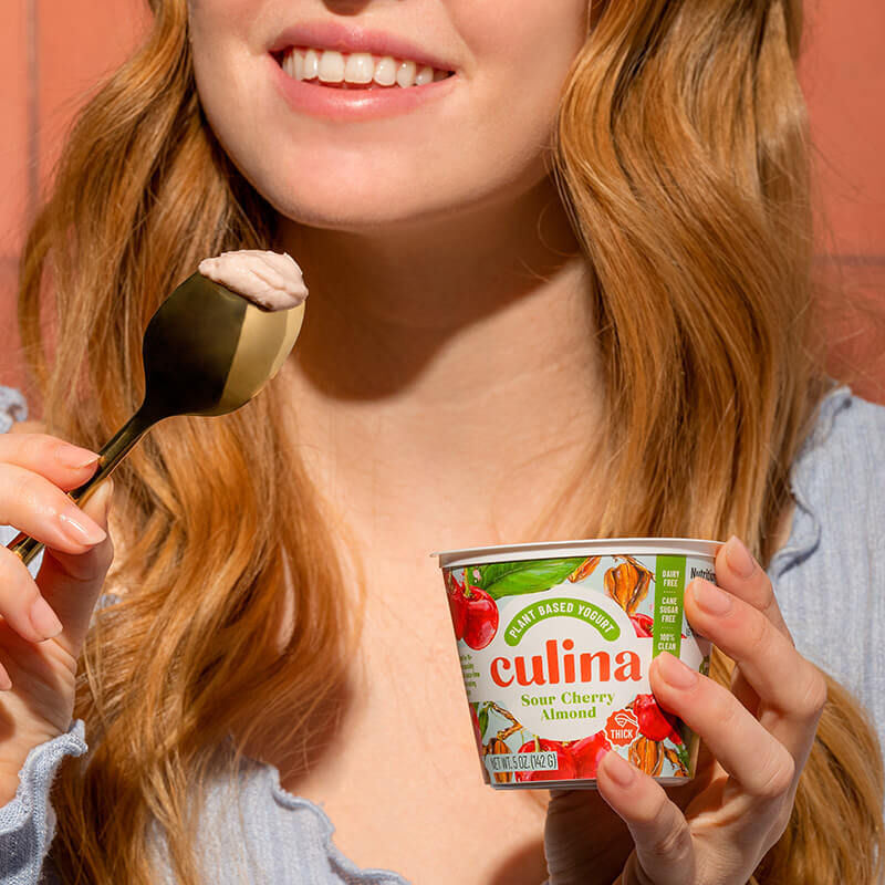 Woman eating Culina yogurt