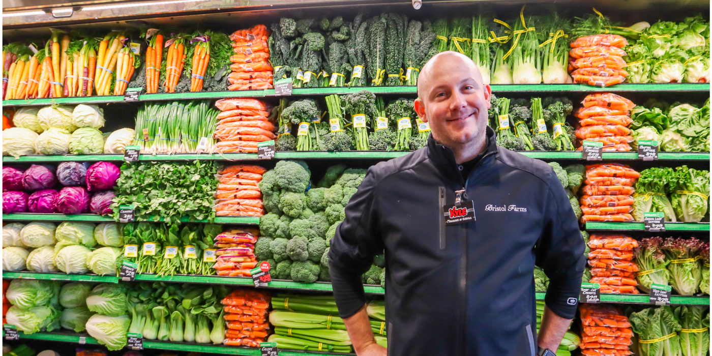 Bristol Farms Product aisle with employee standing infront