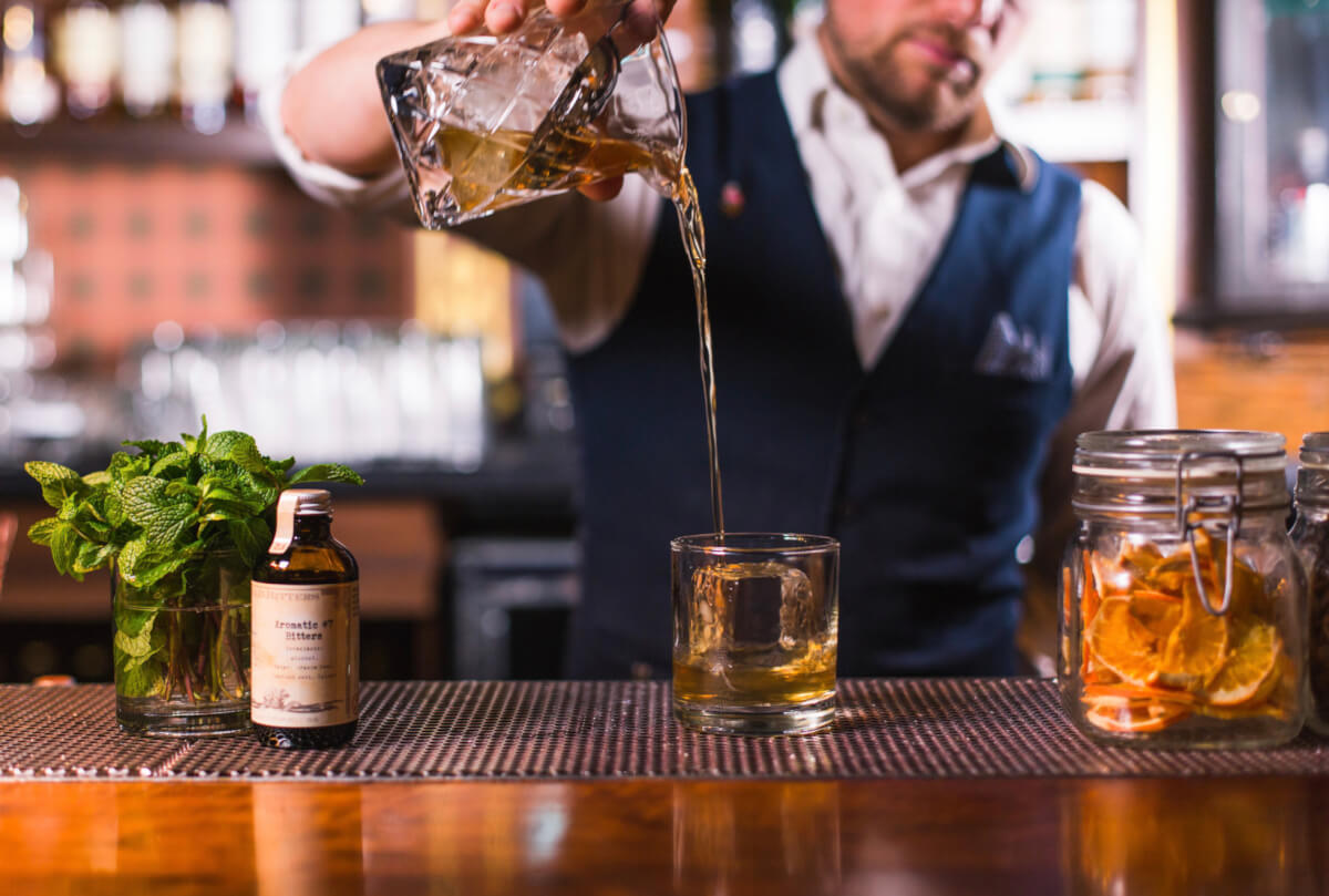 Bartender pouring a cocktail