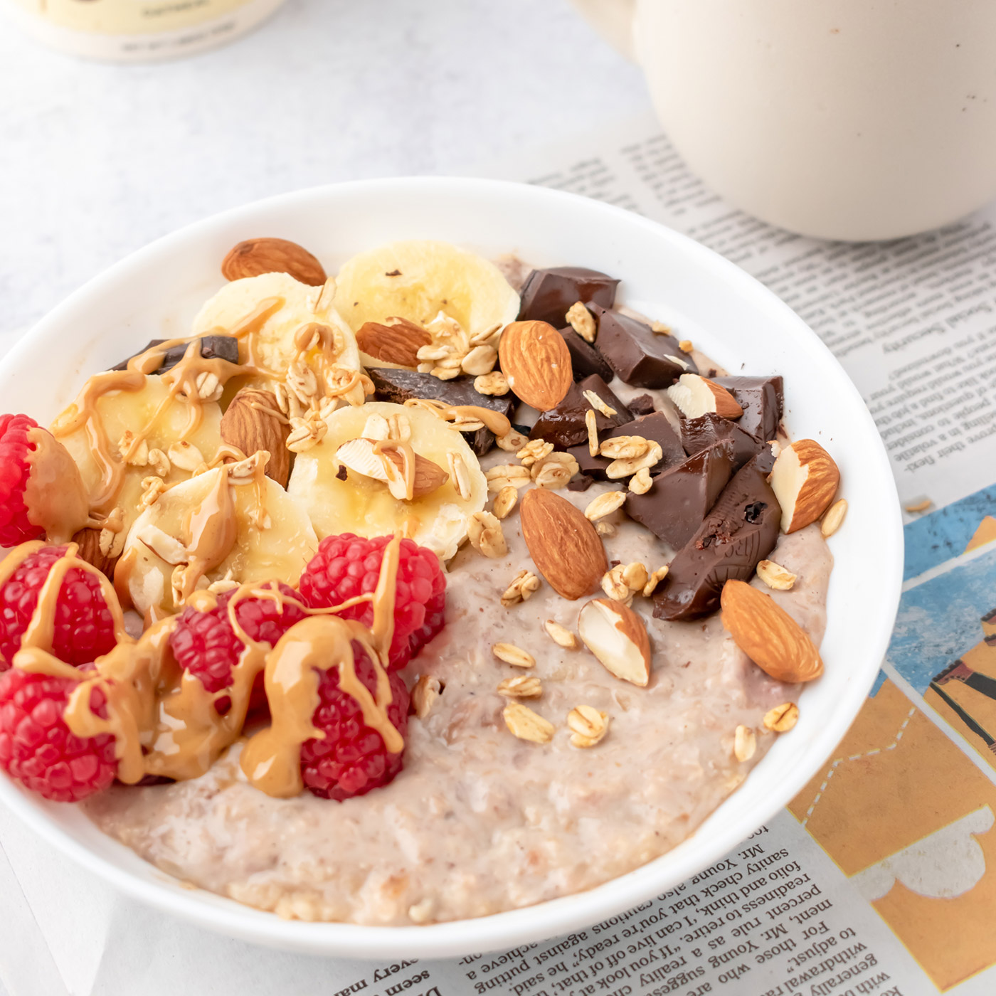 Mylk in a bowl with fresh fruit