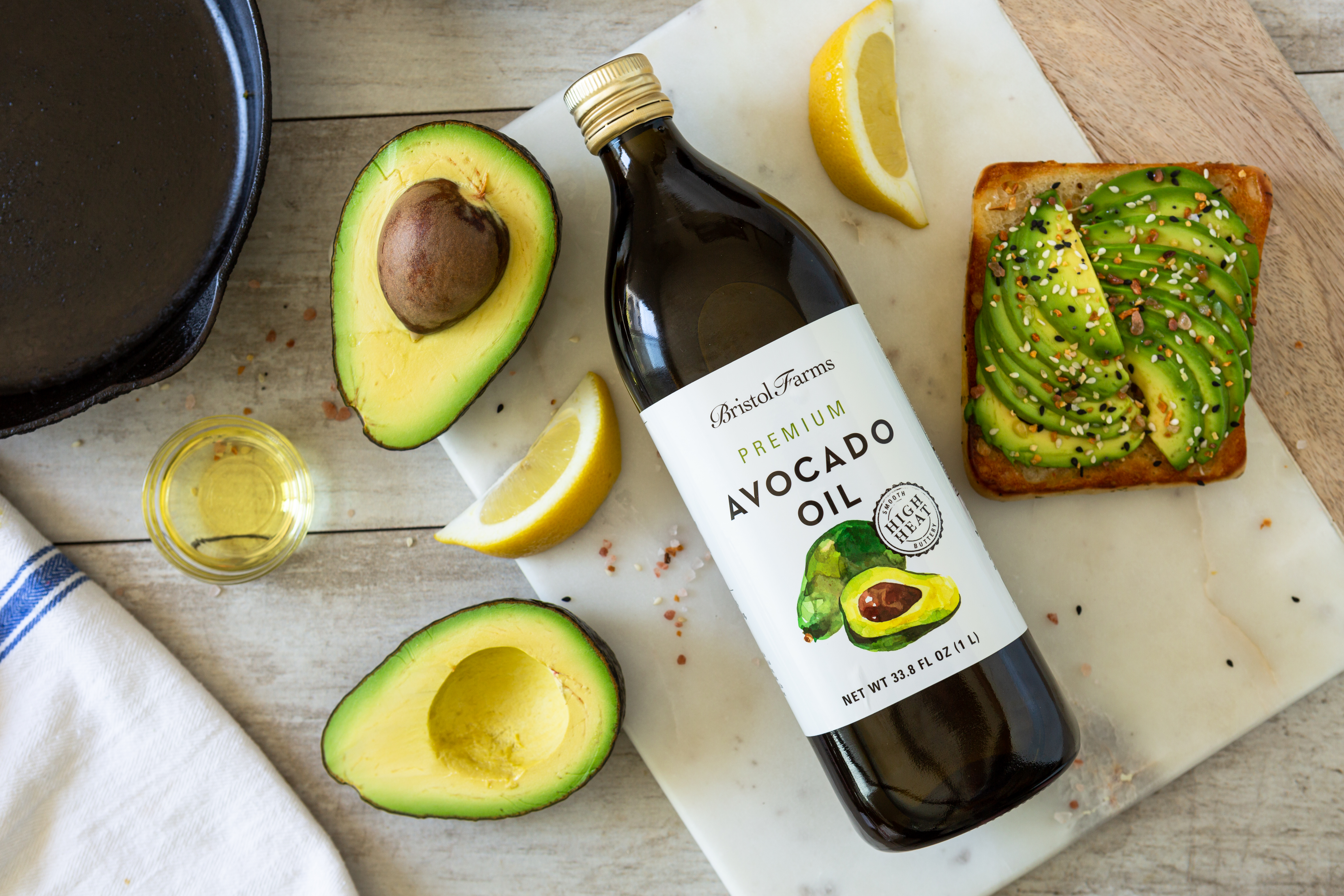 avocado oil with avocado toast on a table