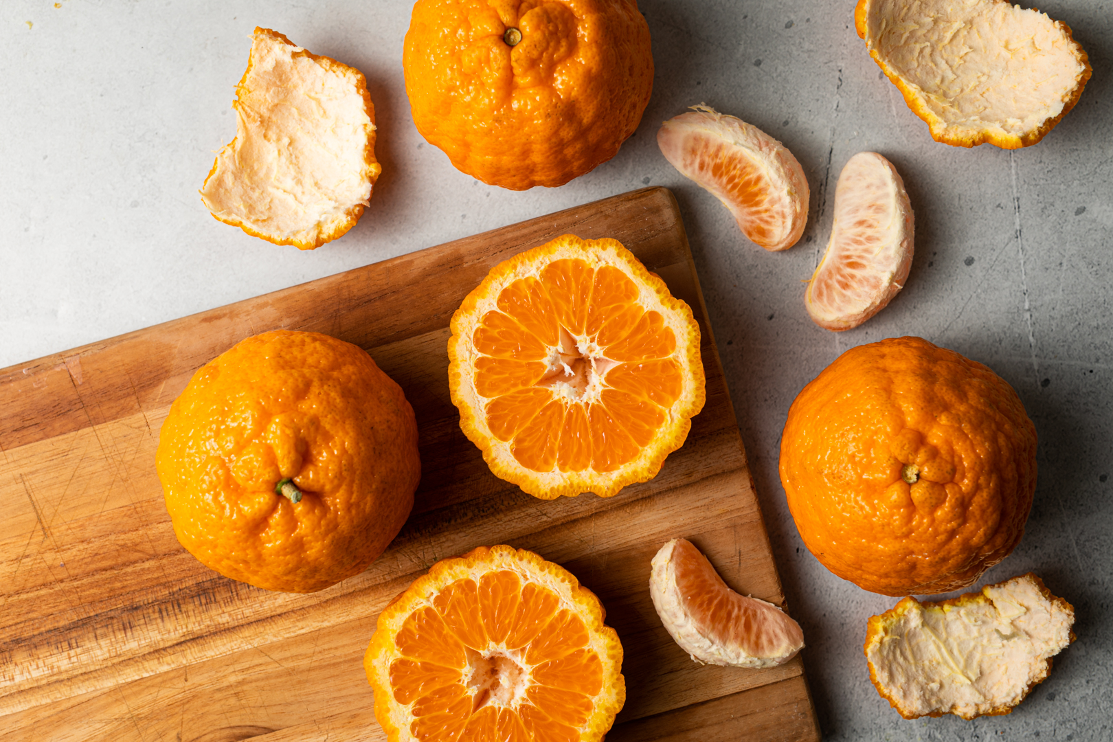 tangerines on a cutting board