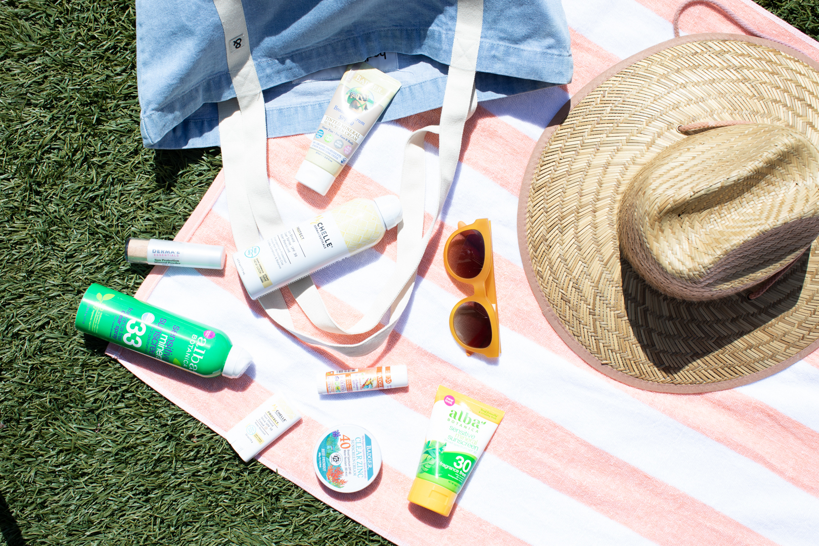 Sunscreens on a beach towel