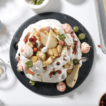 Holiday Pavlova With Pears, Kiwi Berries, And Cranberries