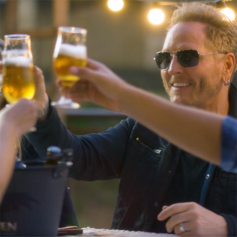 Matt Sorum holding up a glass of beer