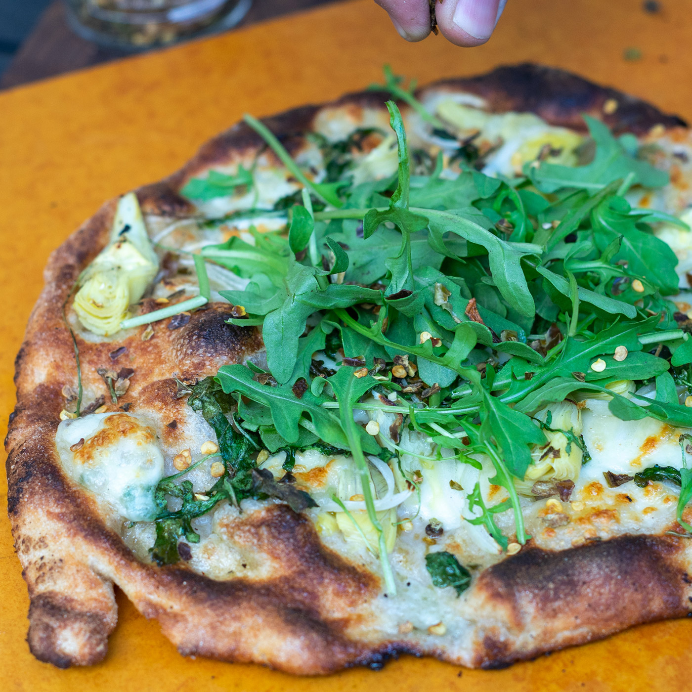 Pizza with cheese and arugula 