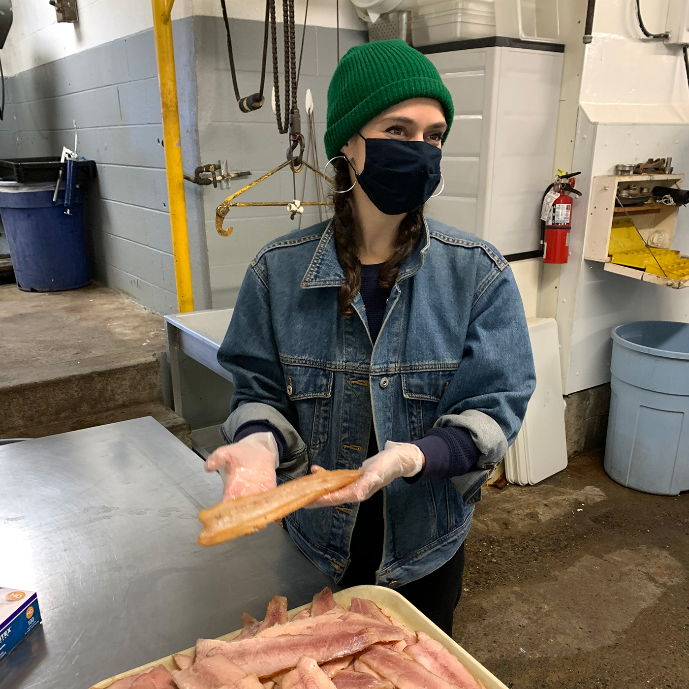 Becca Millstein inspecting fish