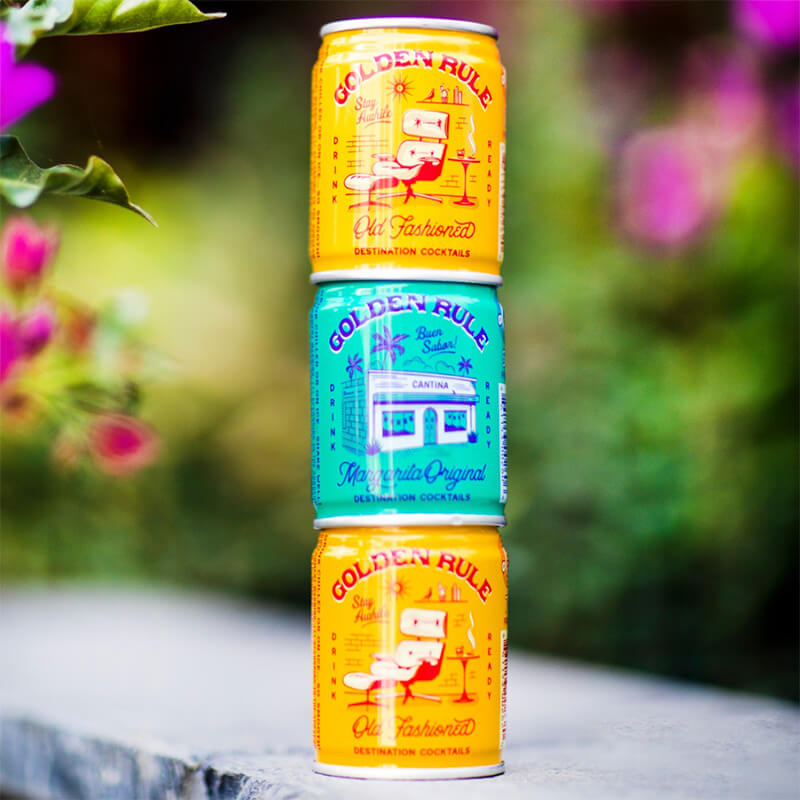 Stacked cans of Golder Rule drinks