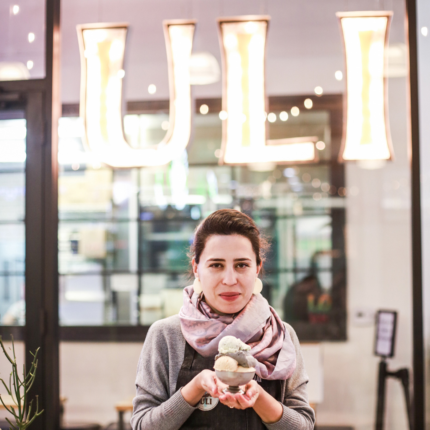 Uli in front of her store with ice cream