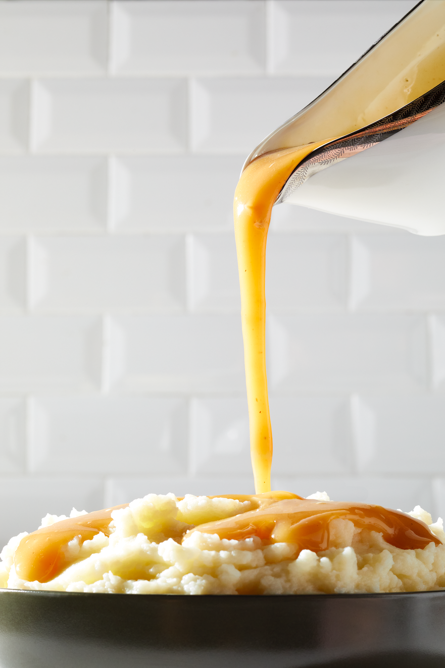 gravy being poured on food