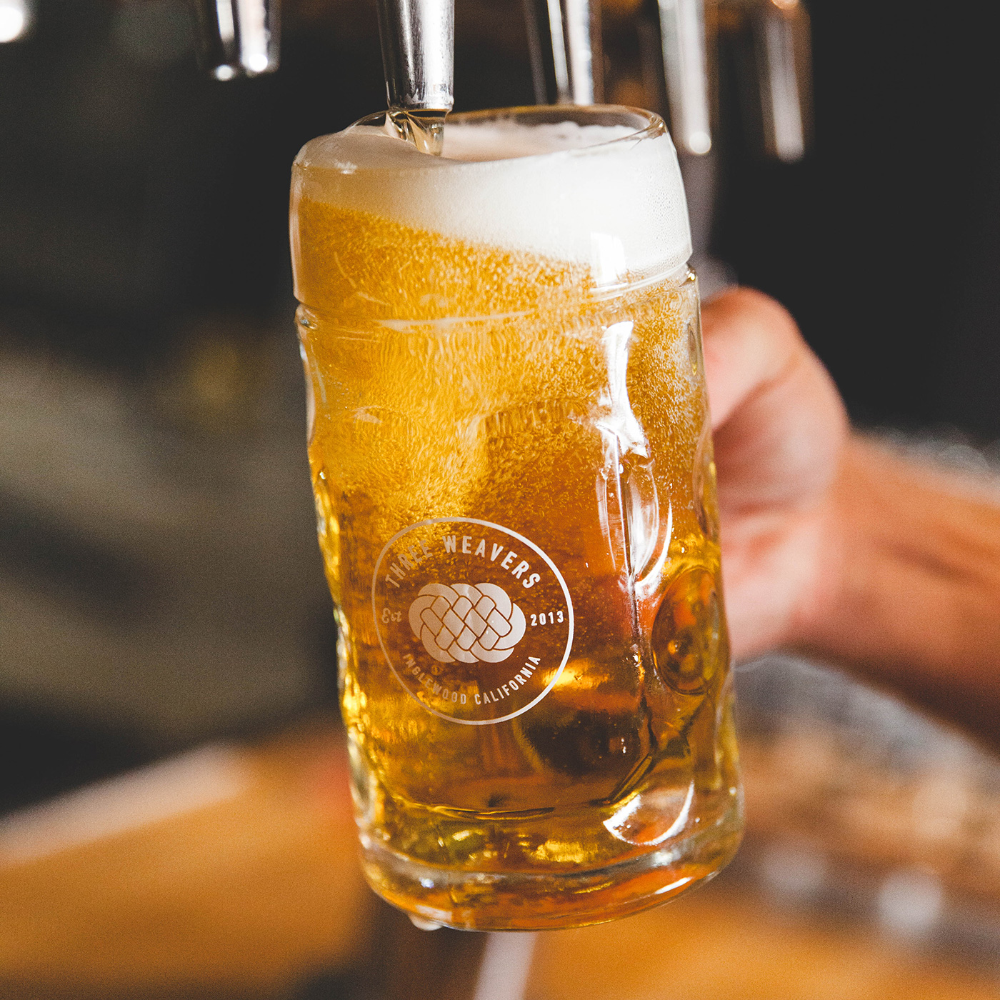 Three Weavers Beer being poured from tap into glass