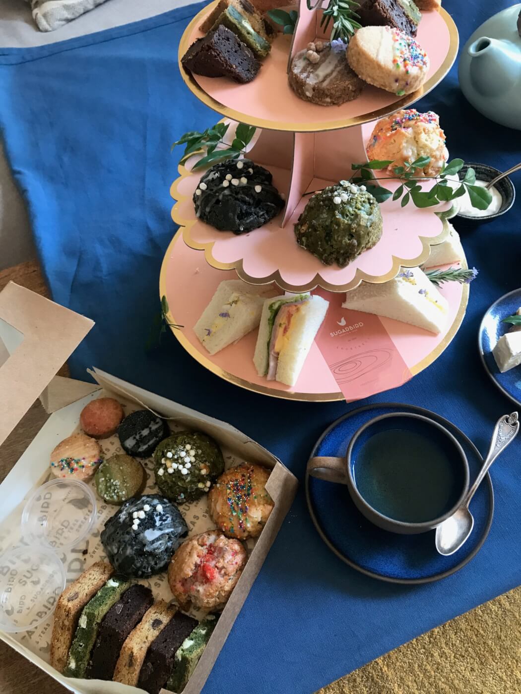 Assortment of tea cakes and sandwiches 