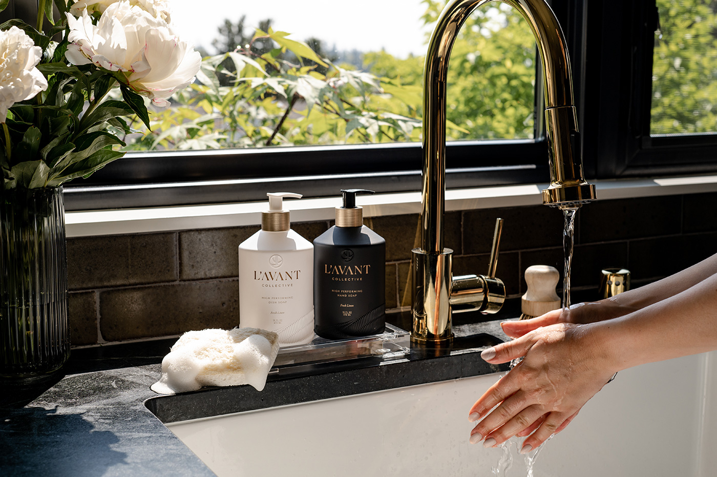 person washing her hands with l'avant