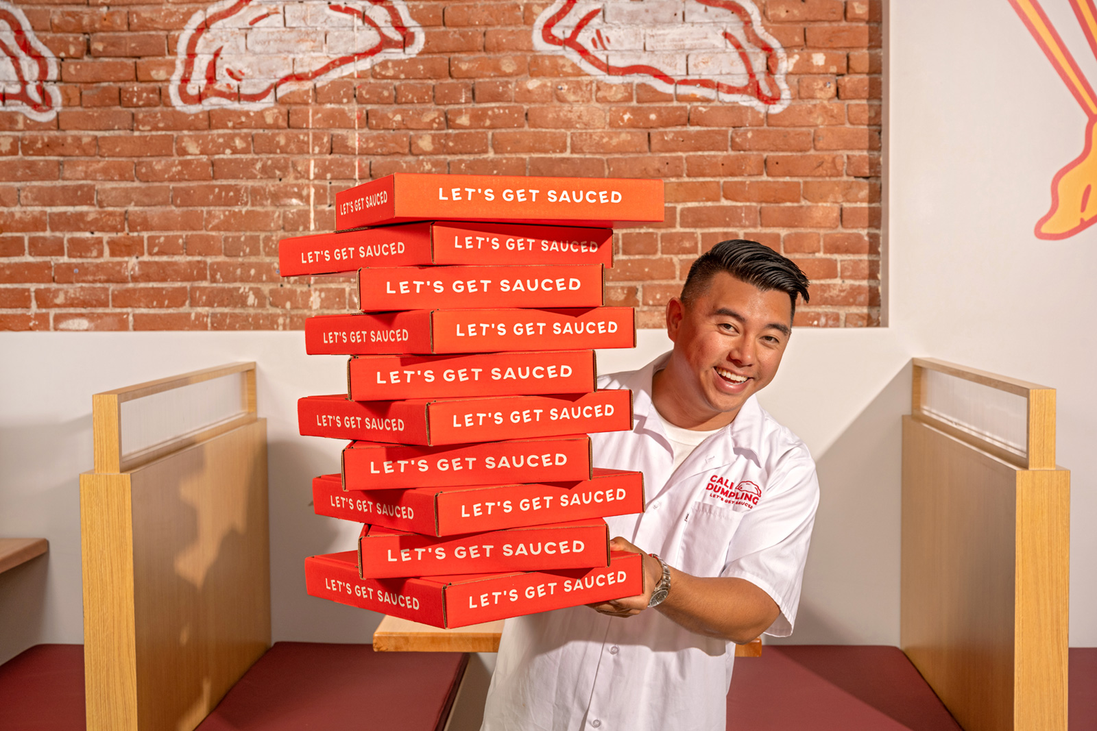 man holding a stack of boxes